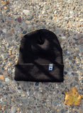 STAR TAG BEANIE IN BLACK